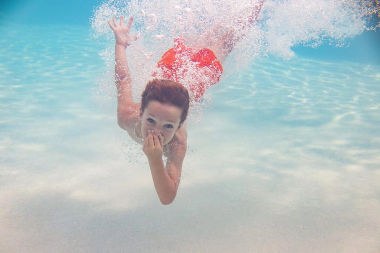 Boy swimming underwater