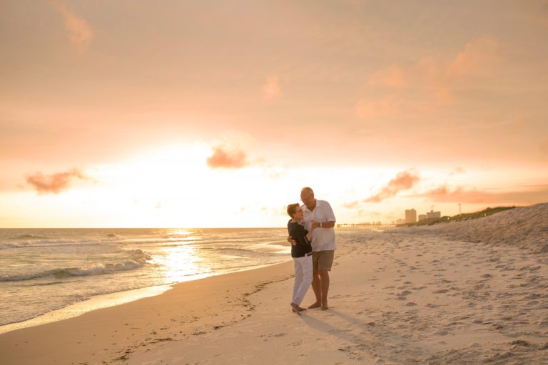 A couple hugging on the beach