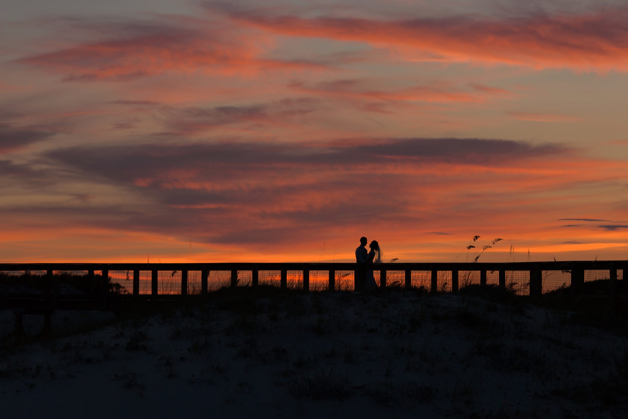 A couple at deep sunset at Sth Walton